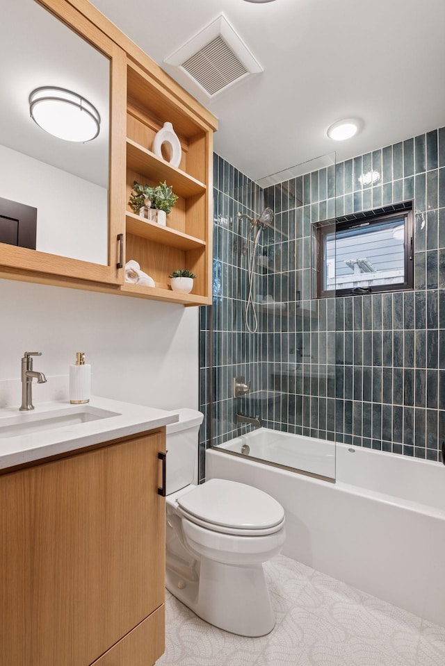 651 Sue Pl, Saint Paul, MN 55116 - bathroom featuring toilet, vanity, shower / tub combination, and tile patterned flooring