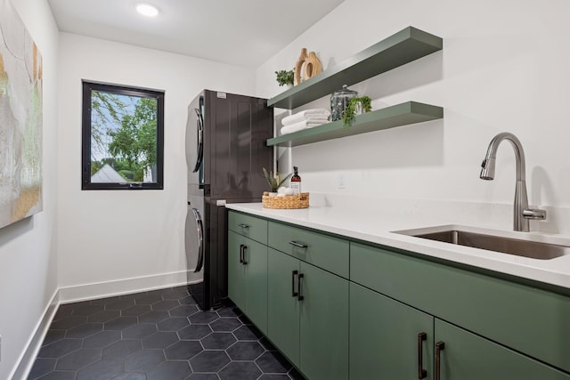 651 Sue Pl, Saint Paul, MN 55116 - kitchen featuring stacked washer / drying machine, green cabinets, a sink, open shelves, and light countertops