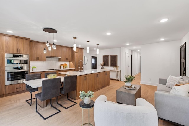 651 Sue Pl, Saint Paul, MN 55116 - living room featuring light wood finished floors, recessed lighting, and baseboards
