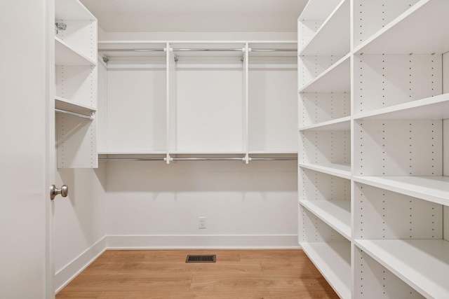 651 Sue Pl, Saint Paul, MN 55116 - walk in closet featuring wood finished floors