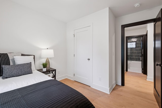 651 Sue Pl, Saint Paul, MN 55116 - bedroom with light wood-style floors and baseboards