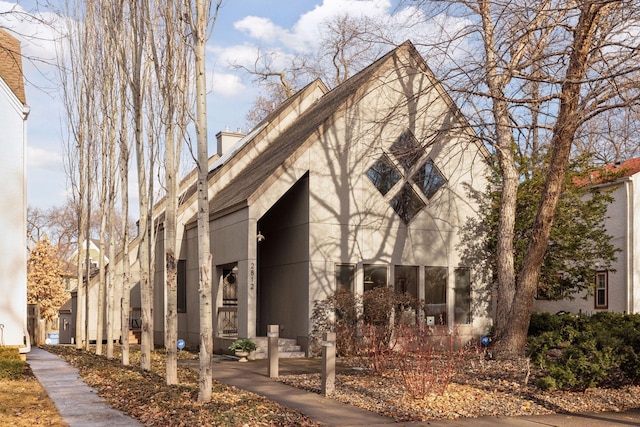 view of side of home featuring stucco siding