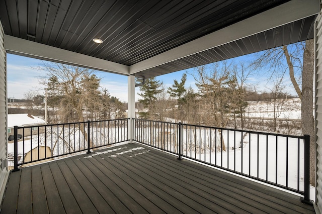 view of snow covered deck