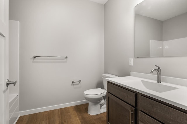 full bathroom with vanity, shower / bathing tub combination, wood-type flooring, and toilet