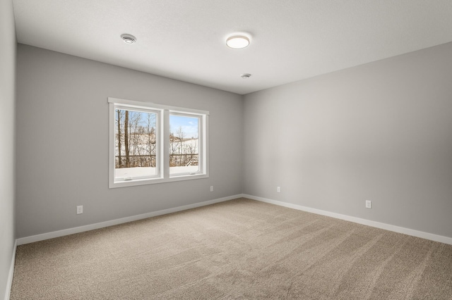 unfurnished room featuring carpet flooring