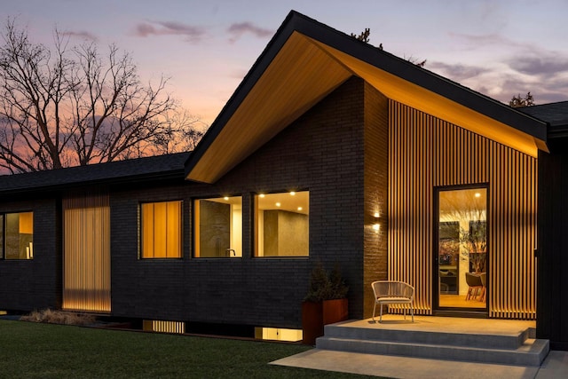 exterior space featuring a patio area and a lawn