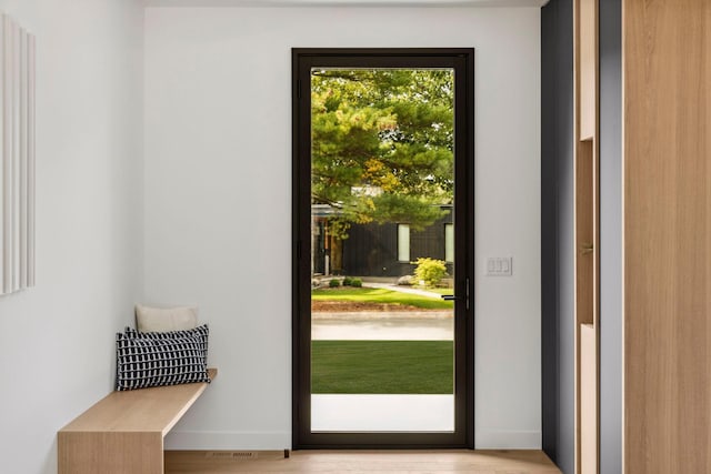 doorway to outside with light hardwood / wood-style flooring