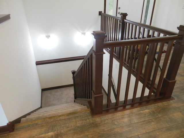 staircase featuring hardwood / wood-style flooring