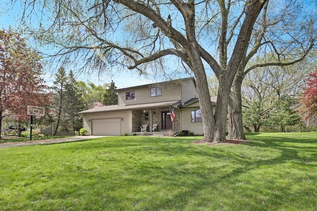 traditional home featuring driveway, a front lawn, and an attached garage