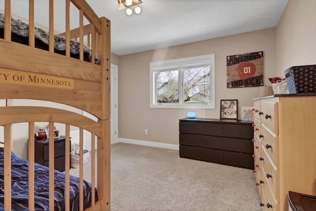 bedroom with arched walkways, light carpet, and baseboards