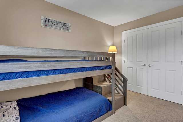 bedroom featuring a closet and carpet flooring