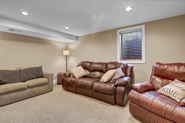 living area with light carpet, visible vents, and recessed lighting