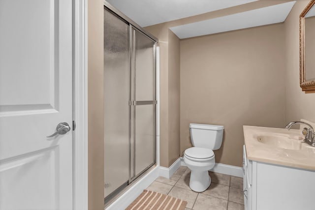 full bath featuring baseboards, toilet, tile patterned floors, vanity, and a shower stall