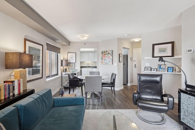 living room featuring hardwood / wood-style floors and sink