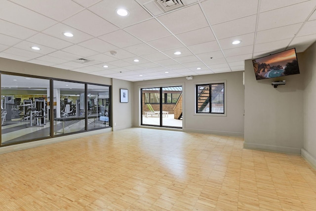 spare room with a drop ceiling