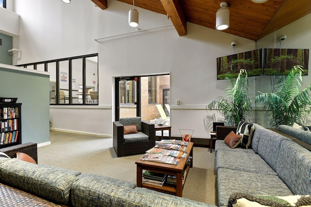 carpeted living room featuring beamed ceiling, wood ceiling, and high vaulted ceiling