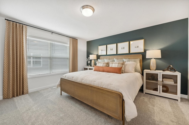 bedroom with light colored carpet