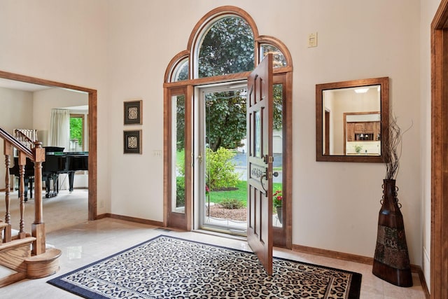 11824 Welters Way, Eden Prairie, MN 55347 - entrance foyer with baseboards, a high ceiling, and stairway