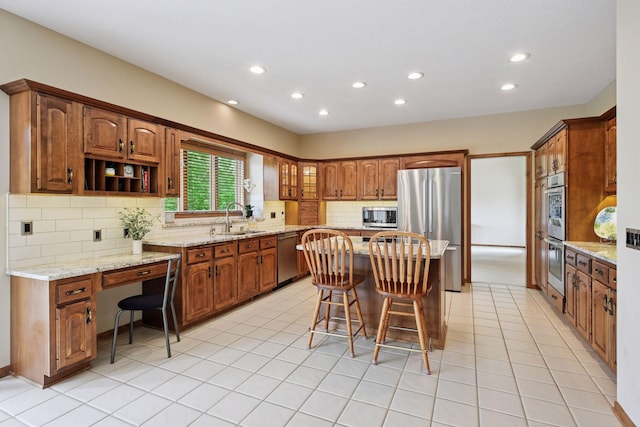 11824 Welters Way, Eden Prairie, MN 55347 - kitchen featuring stainless steel appliances, a sink, a kitchen island, recessed lighting, and tasteful backsplash