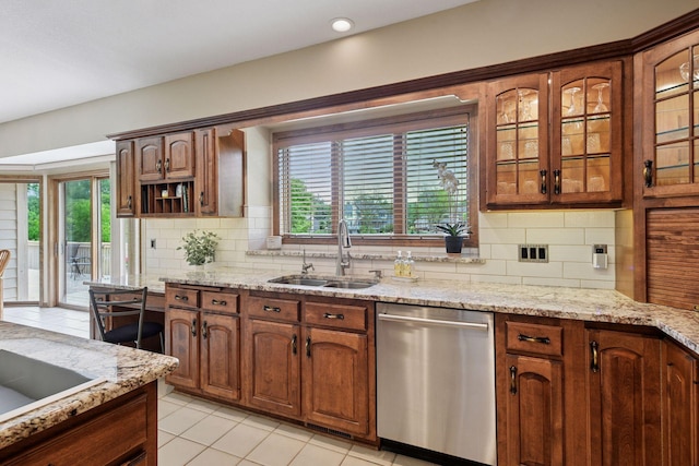 11824 Welters Way, Eden Prairie, MN 55347 - kitchen featuring dishwasher, a sink, healthy amount of natural light, and backsplash
