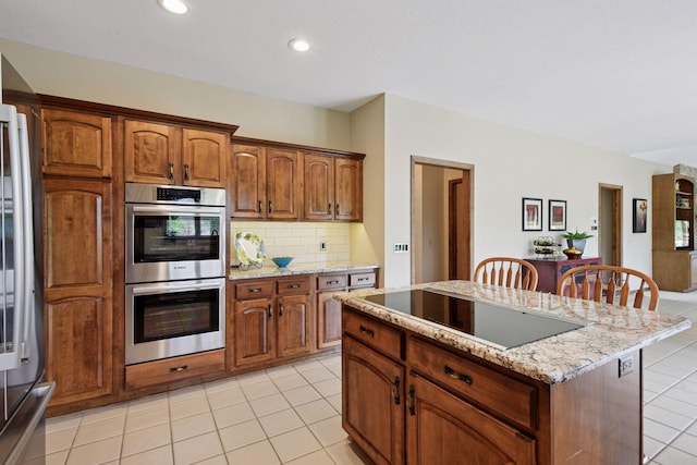 11824 Welters Way, Eden Prairie, MN 55347 - kitchen featuring double oven, black electric cooktop, backsplash, a center island, and light tile patterned flooring