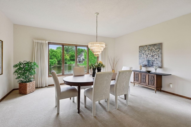 11824 Welters Way, Eden Prairie, MN 55347 - carpeted dining room with a chandelier and baseboards