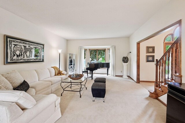 11824 Welters Way, Eden Prairie, MN 55347 - living room featuring stairs, light carpet, and baseboards