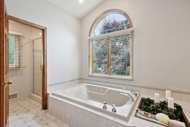 11824 Welters Way, Eden Prairie, MN 55347 - full bathroom featuring vaulted ceiling, a stall shower, and a bath