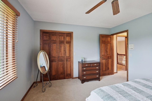 11824 Welters Way, Eden Prairie, MN 55347 - bedroom featuring light carpet, a closet, ceiling fan, and baseboards