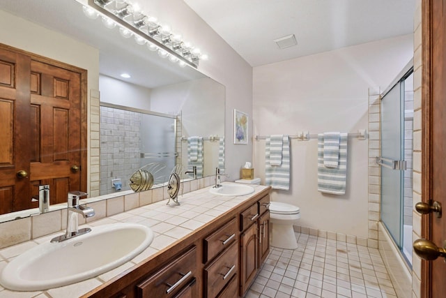 11824 Welters Way, Eden Prairie, MN 55347 - bathroom featuring tile patterned flooring, toilet, double vanity, and baseboards