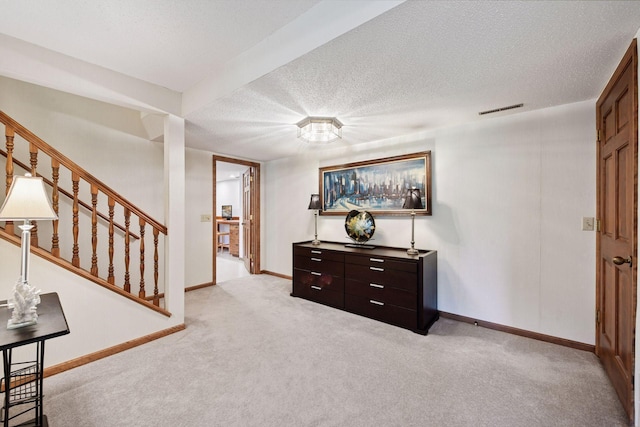 11824 Welters Way, Eden Prairie, MN 55347 - foyer with light carpet, baseboards, stairs, and a textured ceiling