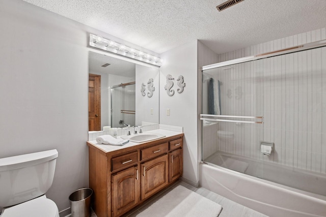 11824 Welters Way, Eden Prairie, MN 55347 - full bathroom with toilet, vanity, bath / shower combo with glass door, and a textured ceiling