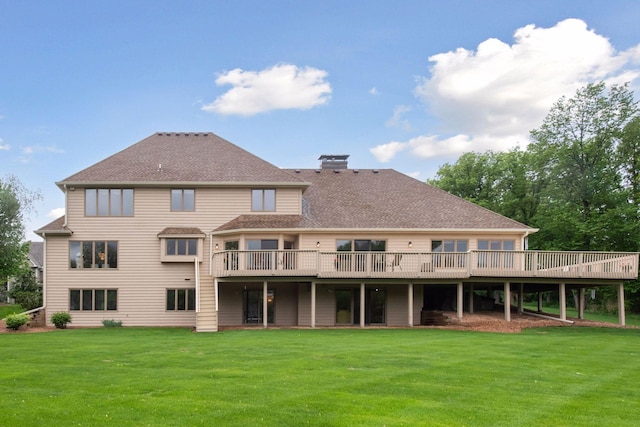 11824 Welters Way, Eden Prairie, MN 55347 - back of property with a wooden deck, a yard, a chimney, and a shingled roof