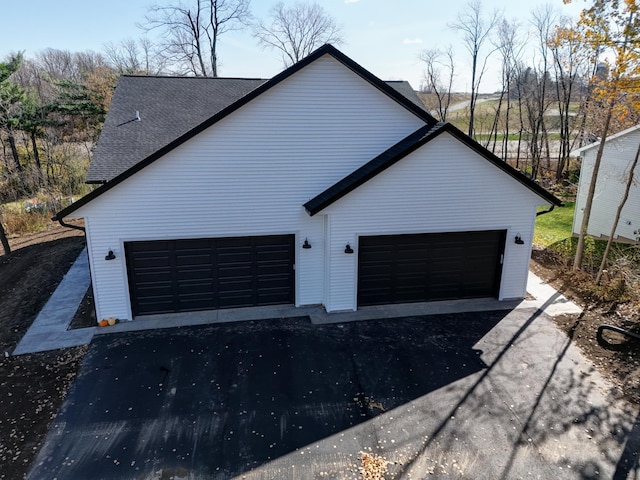 view of side of home with a garage