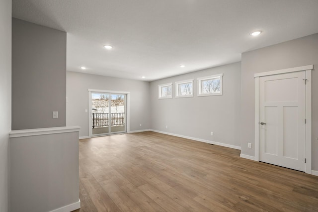 unfurnished room with light hardwood / wood-style floors