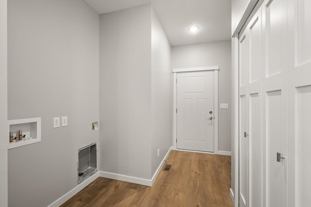 corridor with wood-type flooring