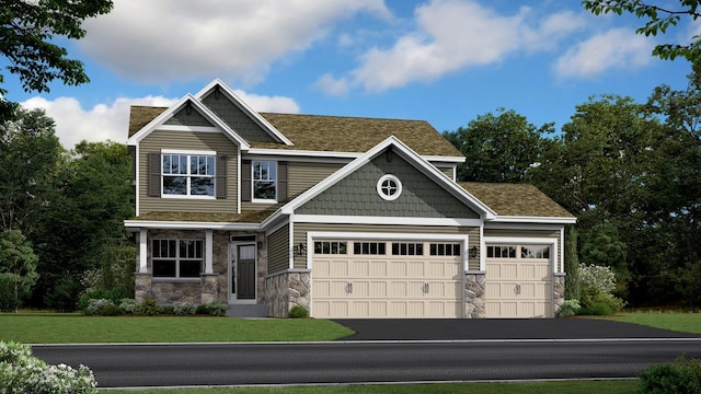 craftsman-style house featuring a garage and a front yard