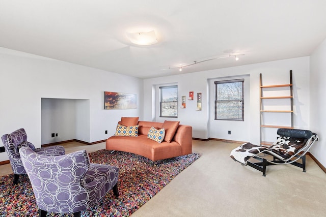 carpeted living room with baseboards