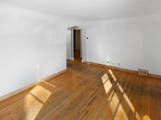 spare room with hardwood / wood-style floors