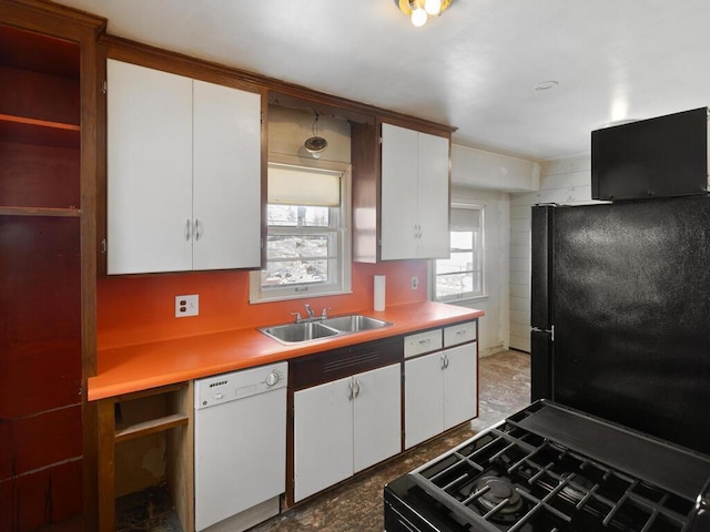 kitchen with white cabinetry, sink, and black appliances