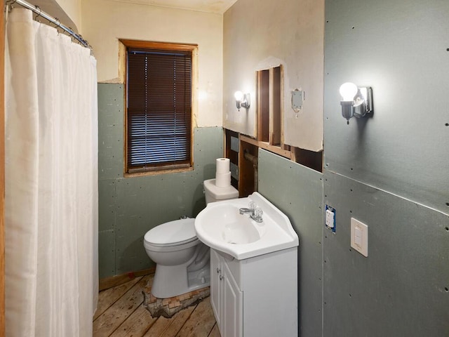 bathroom with vanity, hardwood / wood-style floors, and toilet