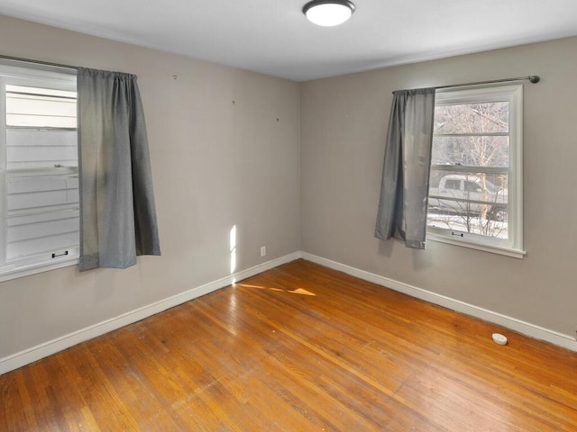 spare room featuring hardwood / wood-style flooring