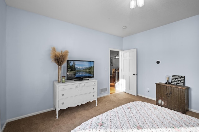 bedroom with light carpet, visible vents, and baseboards