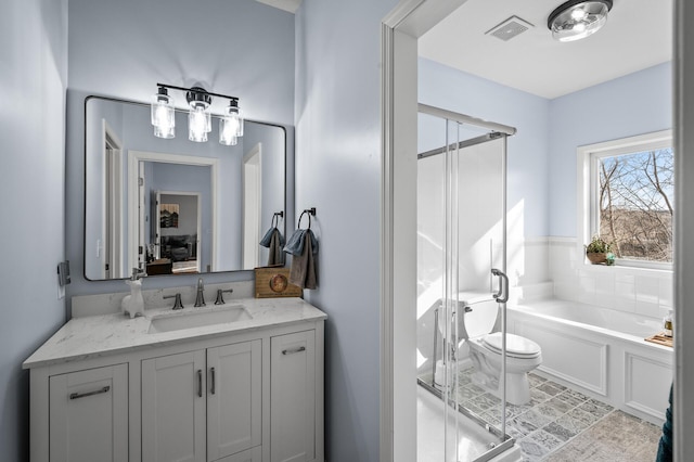 full bath featuring visible vents, toilet, a shower stall, vanity, and a bath