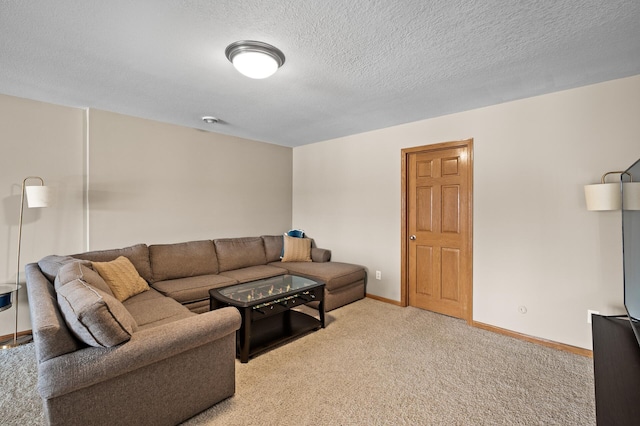 living area with light carpet, a textured ceiling, and baseboards