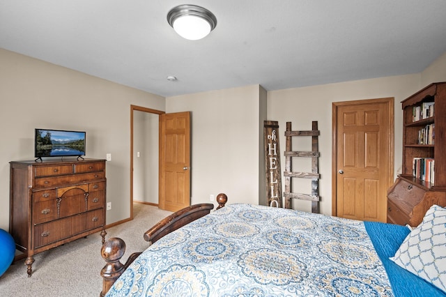 bedroom featuring light colored carpet and baseboards