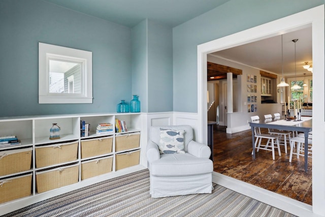 sitting room with wood-type flooring