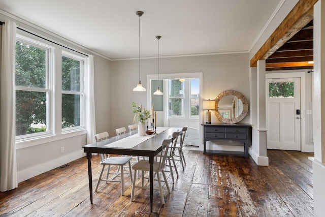 dining space featuring dark wood-type flooring and ornamental molding