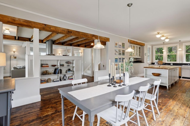 dining room with dark hardwood / wood-style flooring and beam ceiling