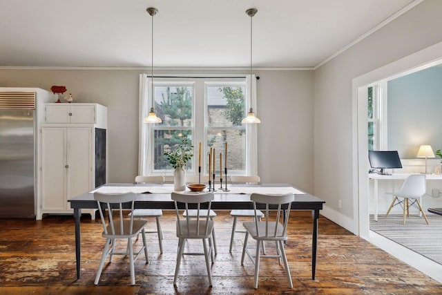 dining space with ornamental molding and dark hardwood / wood-style floors